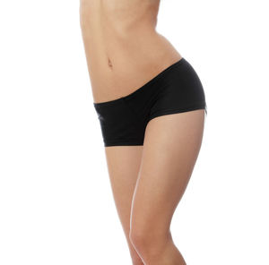 Midsection of woman standing against white background