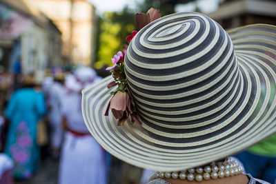 Rear view of woman wearing hat in city