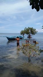 Full length of man on beach against sky