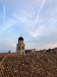 Buildings in city against sky