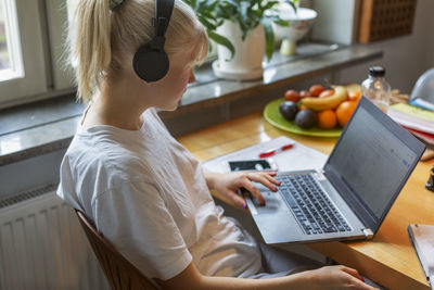 Young woman using laptop