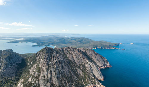 Aerial drone view of coles bay and freycinet national park. hazards mountain range in the foreground