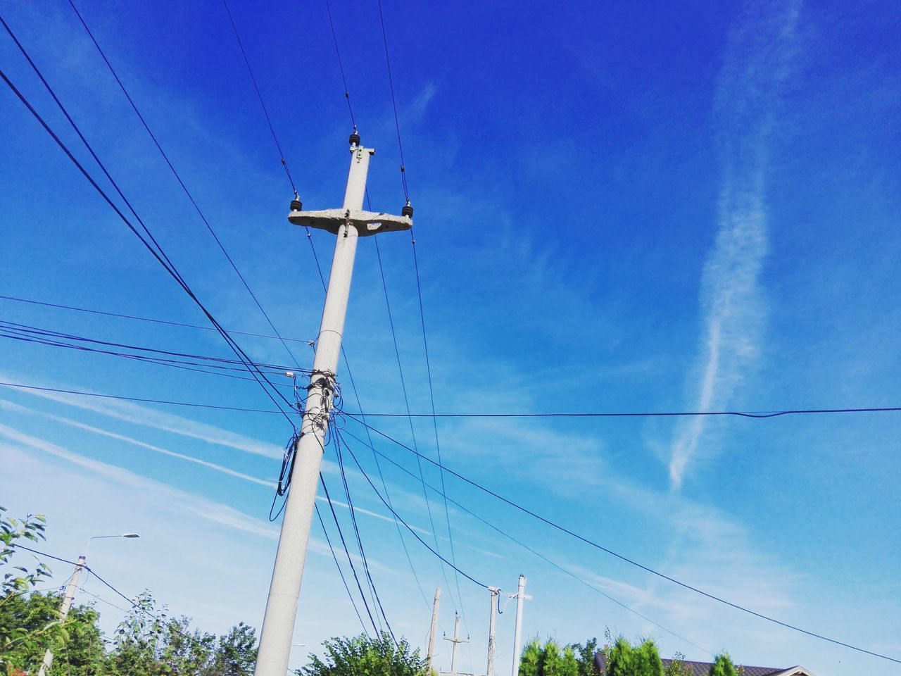 LOW ANGLE VIEW OF TELEPHONE POLE AGAINST SKY