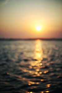 Scenic view of sea against romantic sky at sunset