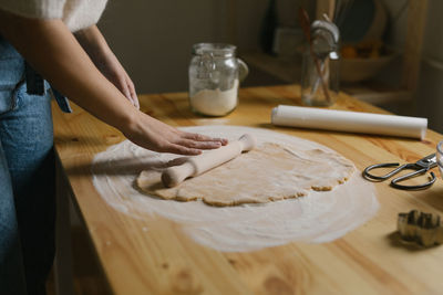 Young woman making christmas cookies