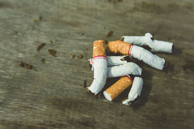 High angle view of cigarette butts on table