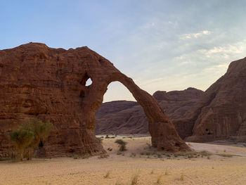 Rock formations in desert against sky