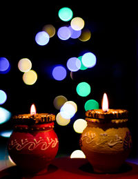 Close-up of illuminated tea light candles
