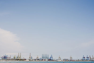 Panoramic view of sea and buildings against sky