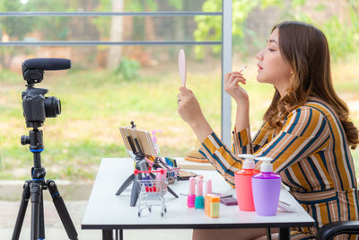 Side view of a girl drinking coffee