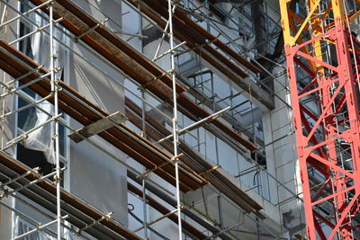 Low angle view of crane in building