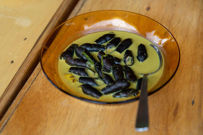 Black sea snail cooked in a traditional malay dish using coconut cream.