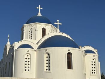 Low angle view of church against clear blue sky