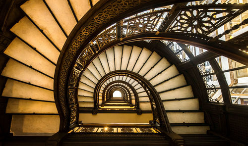 Low angle view of spiral staircase in building