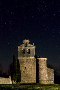 Historic building against sky at night