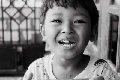 Close-up of a cute boy laughing happily