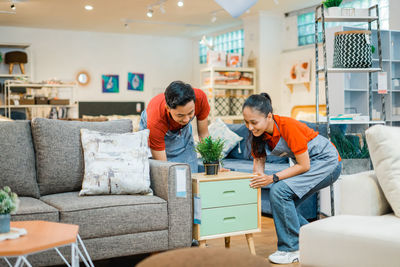 Side view of a young friends at home