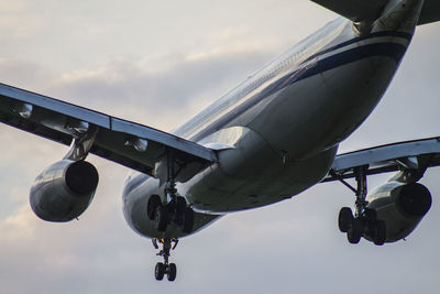 Low angle view of airplane against sky