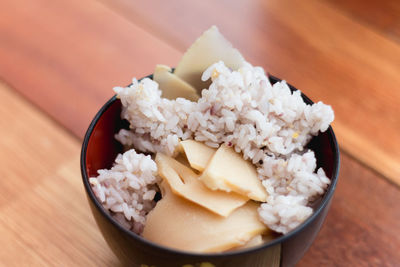 High angle view of ice takenori gohan in bowl on table in japan