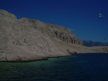 Scenic view of sea against blue sky