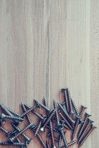 High angle view of chain on table against wall