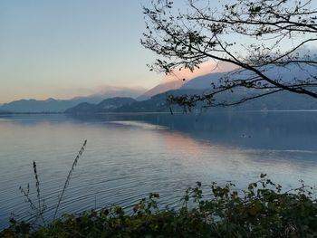 Scenic view of lake against sky during sunset