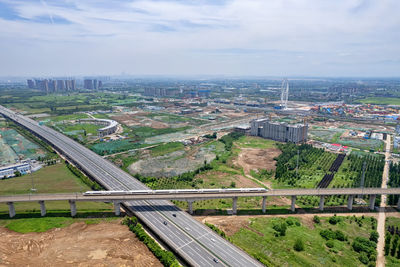 High angle view of city and buildings against sky