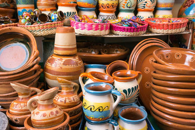 Close-up of various clay pots indoors