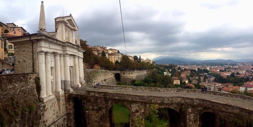 View of city against cloudy sky