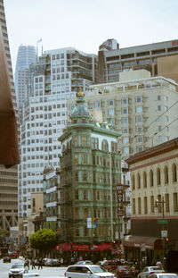 Buildings in city against sky