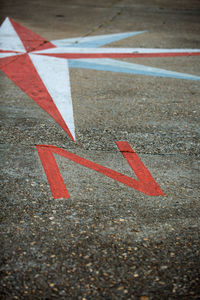 Close-up of arrow symbol on road