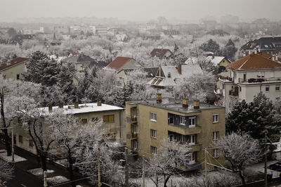 High angle view of houses in city during winter