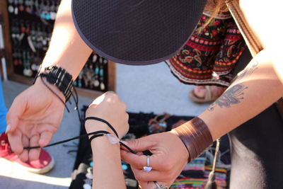 High angle view of young woman holding hands