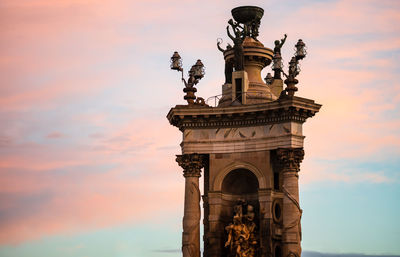 Low angle view of statue against sky during sunset