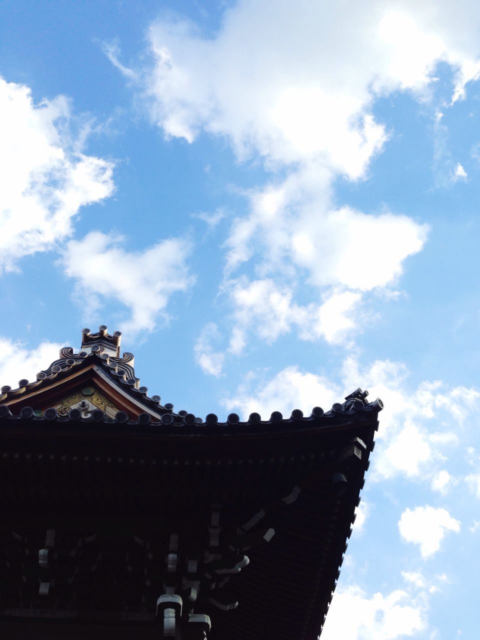 architecture, low angle view, built structure, building exterior, sky, place of worship, religion, cloud - sky, spirituality, temple - building, famous place, cloud, history, travel destinations, cloudy, ornate, tourism, travel, high section