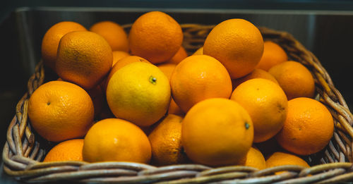 Close-up of oranges in container