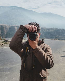 Man photographing on camera