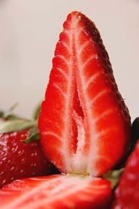 Close-up of red balloon over white background