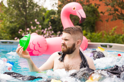 Portrait of young man in swimming pool