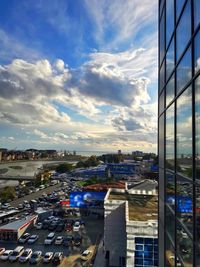 High angle view of city street and buildings against sky