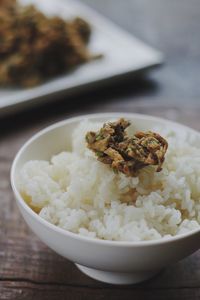 Close-up of rice with vegetable in bowl on table