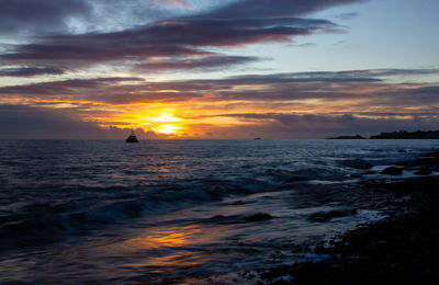 Scenic view of sea against sky during sunset