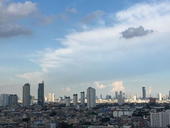 Modern buildings in city against sky