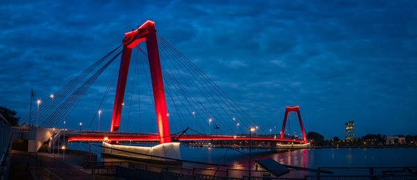 Golden gate bridge over river against sky