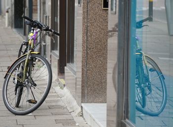 Low section of man riding bicycle on street