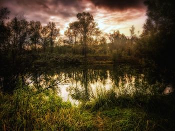 Scenic view of lake at sunset