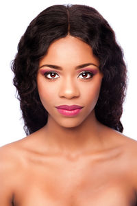 Portrait of beautiful young woman against white background