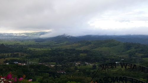 High angle view of building and mountains against sky