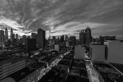 High angle view of modern buildings in city against sky