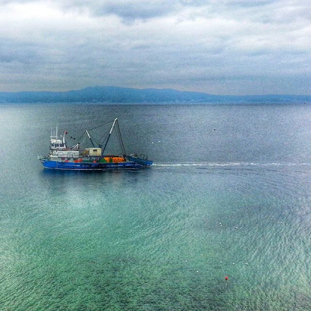 nautical vessel, transportation, mode of transport, water, boat, sea, sky, waterfront, sailing, tranquility, tranquil scene, cloud - sky, scenics, nature, beauty in nature, moored, travel, rippled, horizon over water, cloud